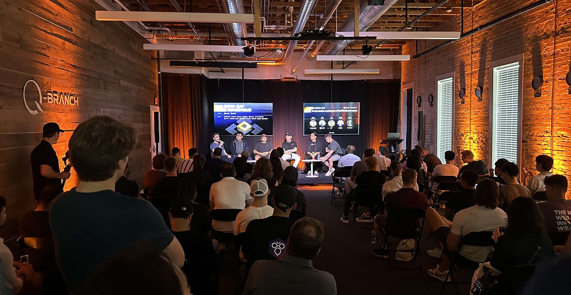 A packed panel and a full room at Q Branch in downtown Austin