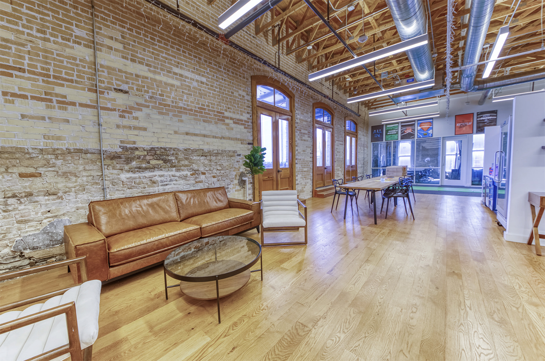 Open desks and lounge in the Q Branch indoor space